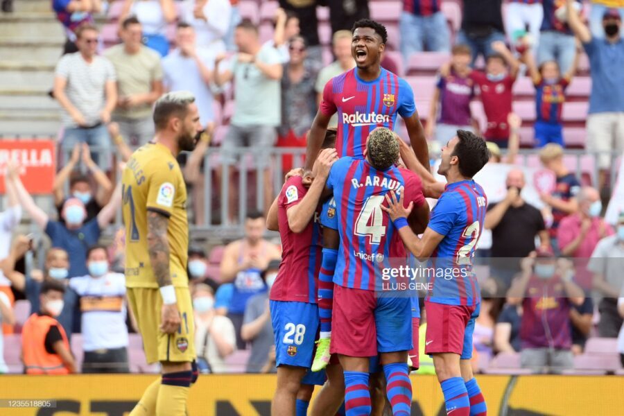 Barcelona's Spanish midfielder Ansu Fati (TOP) celebrates scoring his team's third goal during the Spanish League football match between FC Barcelona and Levante UD at the Camp Nou stadium in Barcelona on September 26, 2021. (Photo by LLUIS GENE / AFP) (Photo by LLUIS GENE/AFP via Getty Images)